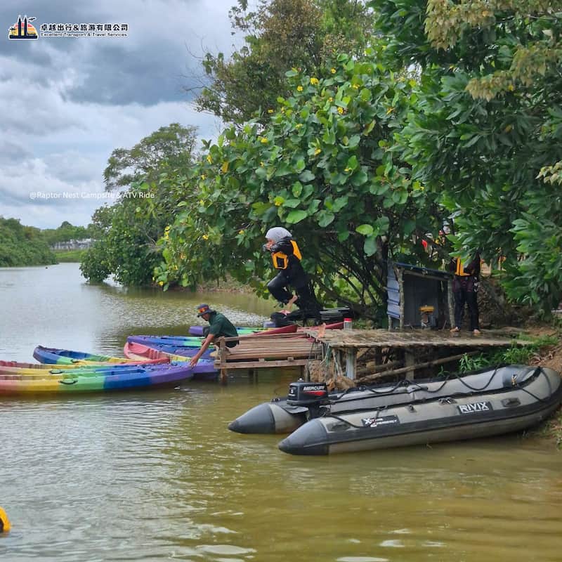 Kayaks and boats beside the water at Raptor Outdoor